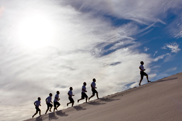 runners running up a hill